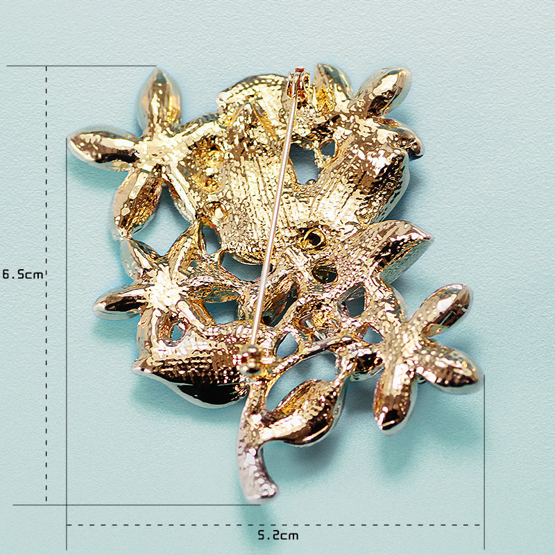 Champagne Gold Floral Brooch – Crystal Flower Pin with Enamel Detail